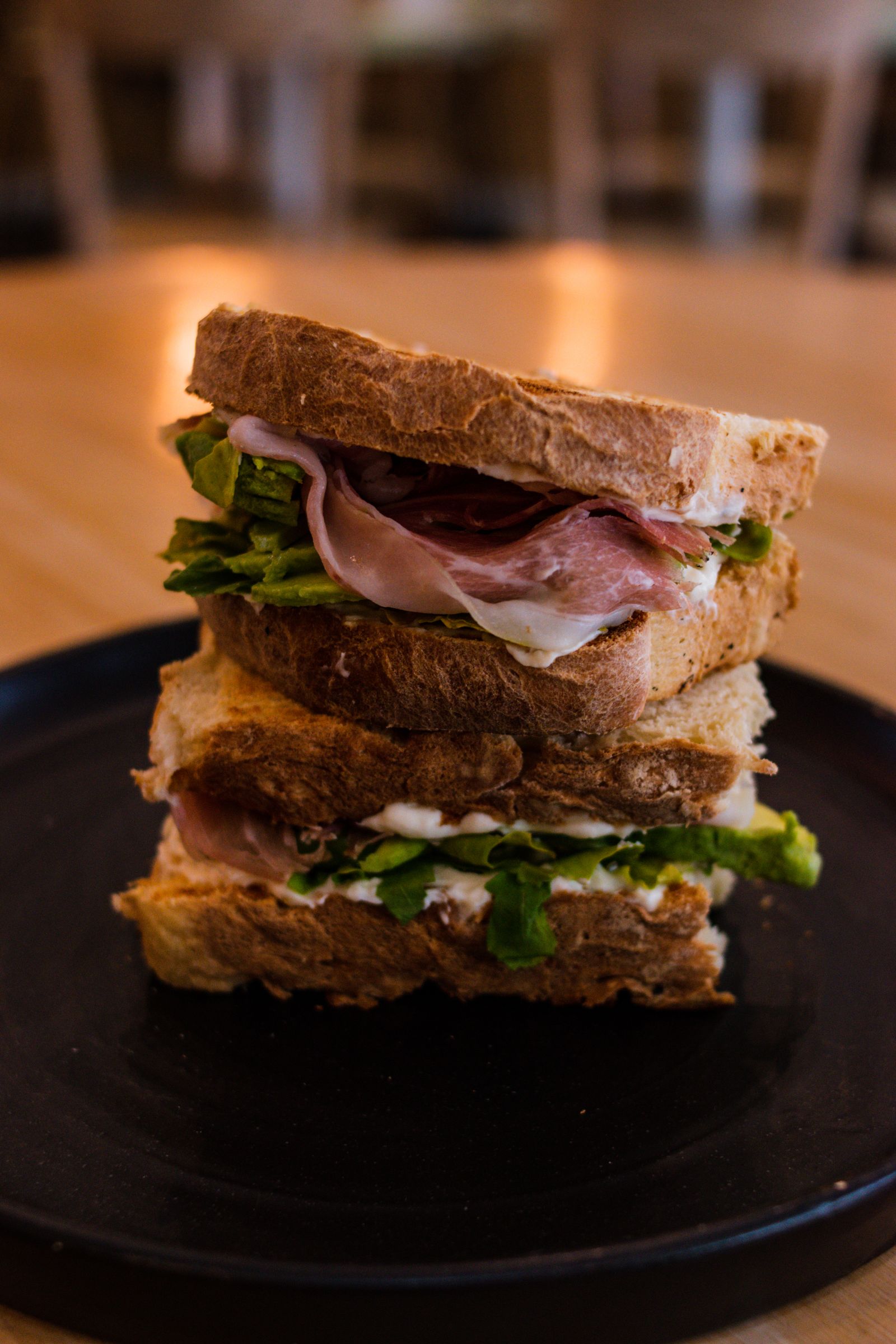 Deli sandwich stacked high with sliced meat